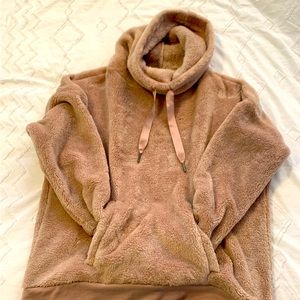 Light pink fuzzy sweatshirt. Size medium in women’s.